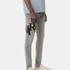 JEAN SKINNY AVEC LOGO DÉCALÉ